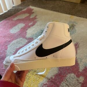 Nike White High-Top Sneakers with Black Swoosh